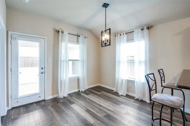 a view of a room with furniture window and wooden floor
