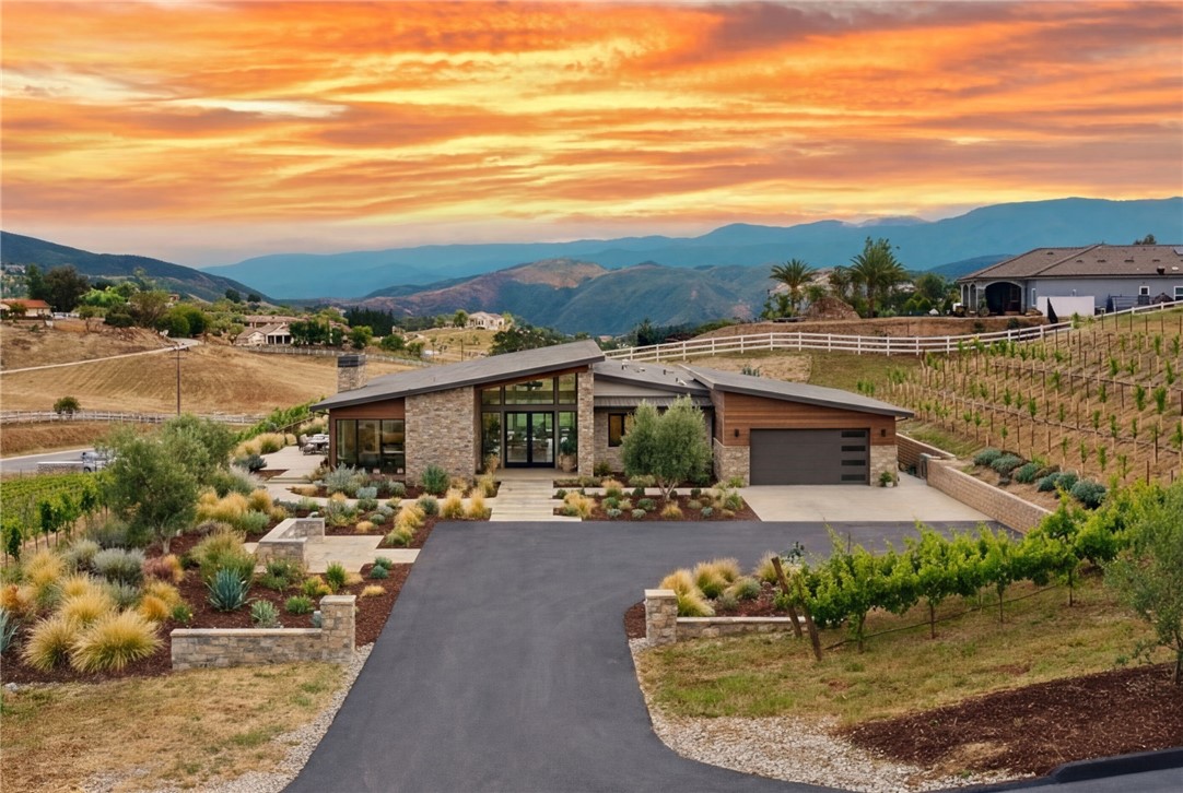 36191 Summit Circle Temecula, CA 92592 - Photo 11 of 33 an aerial view of a house with a yard lake and mountain view in back
