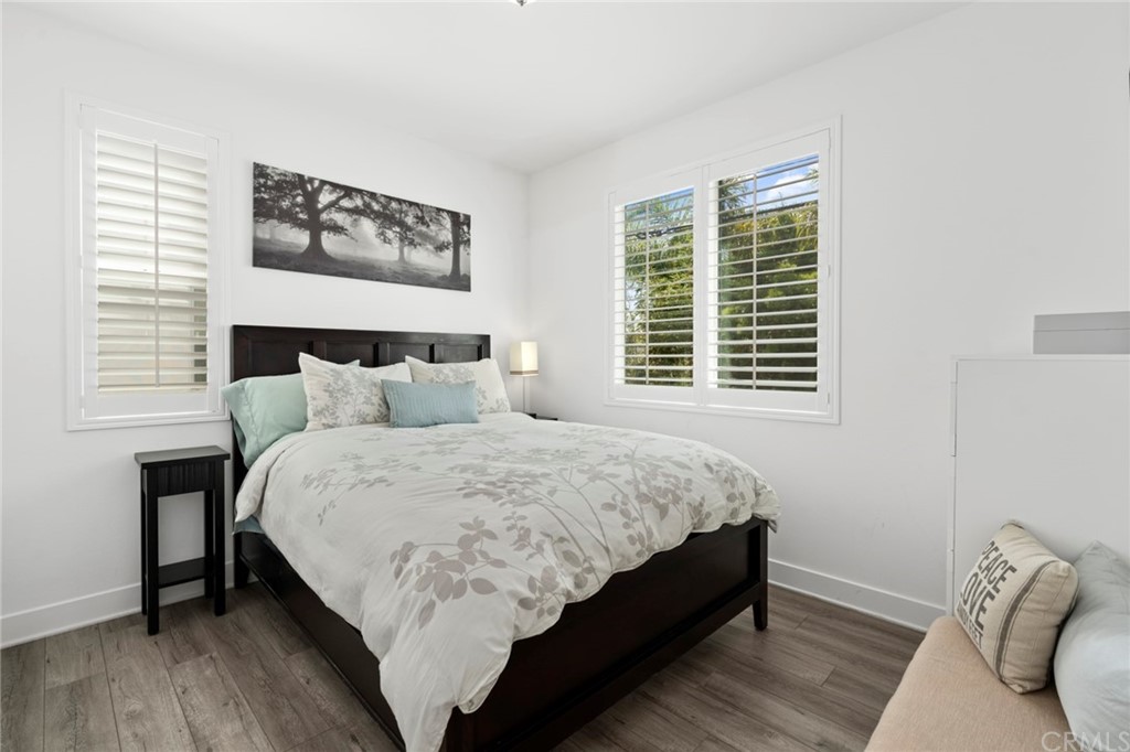 1267 Westreef Costa Mesa, CA 92627 - Photo 12 of 34 a bedroom with bed and a window