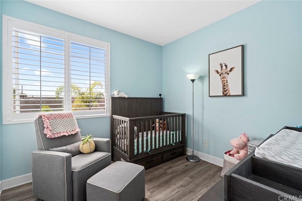 1267 Westreef Costa Mesa, CA 92627 - Photo 13 of 34 a bedroom with furniture and a window