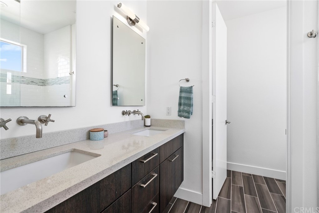 1267 Westreef Costa Mesa, CA 92627 - Photo 17 of 34 a bathroom with a sink and a mirror