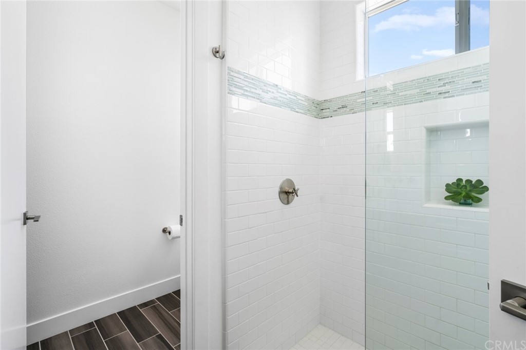 1267 Westreef Costa Mesa, CA 92627 - Photo 18 of 34 a bathroom with a shower