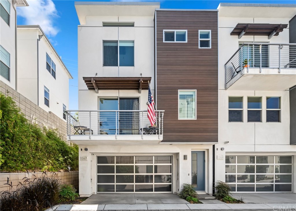 1267 Westreef Costa Mesa, CA 92627 - Photo 22 of 34 a front view of a building with glass windows