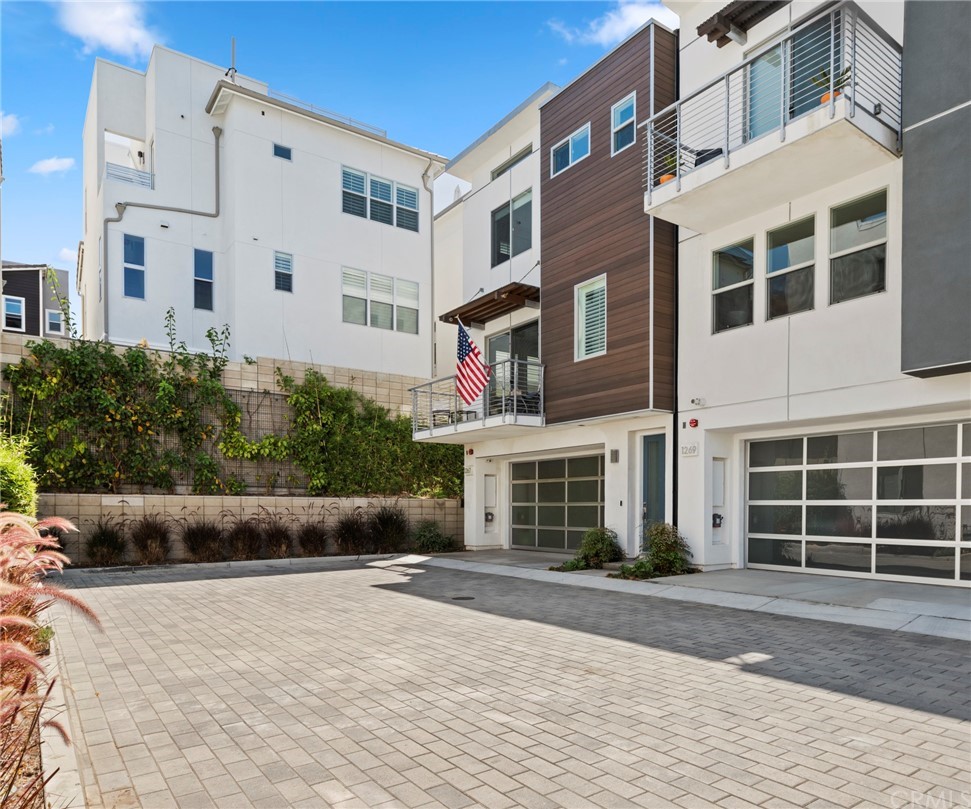 1267 Westreef Costa Mesa, CA 92627 - Photo 23 of 34 a view of a building with a yard