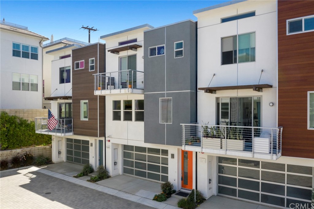 1267 Westreef Costa Mesa, CA 92627 - Photo 28 of 34 a front view of a building with windows