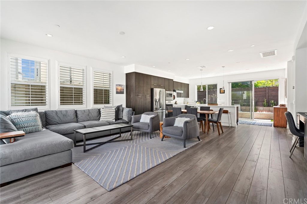 1267 Westreef Costa Mesa, CA 92627 - Photo 3 of 34 a living room with furniture and a large window