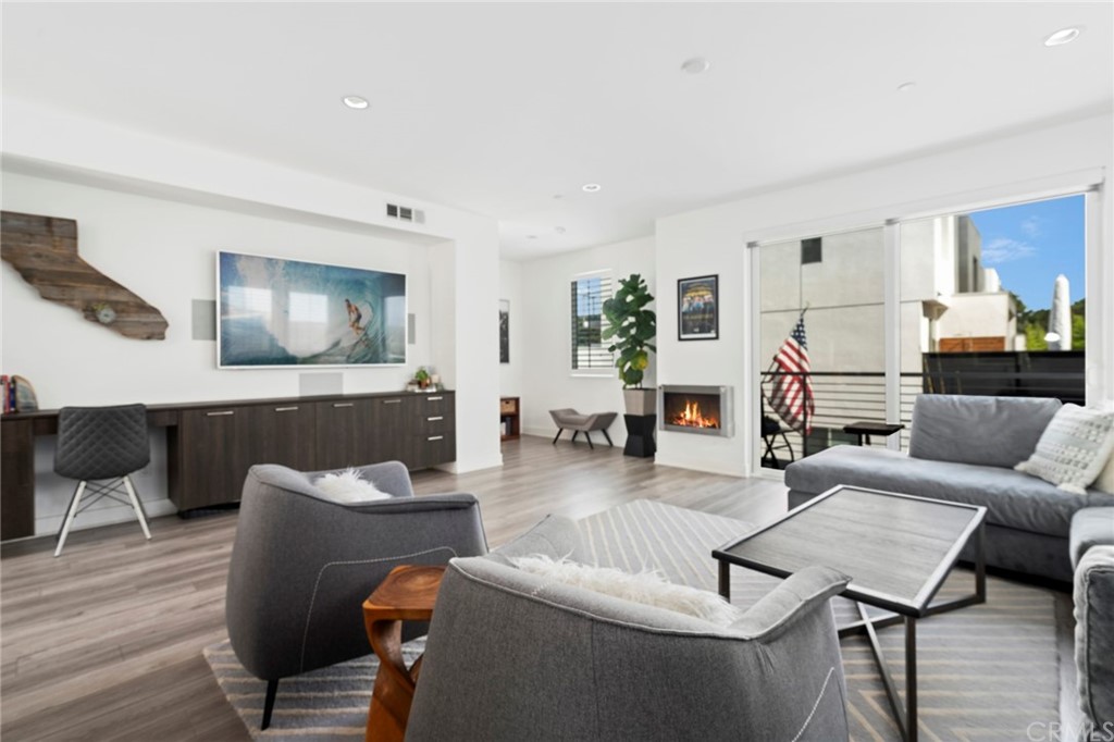 1267 Westreef Costa Mesa, CA 92627 - Photo 4 of 34 a living room with furniture and a wooden floor