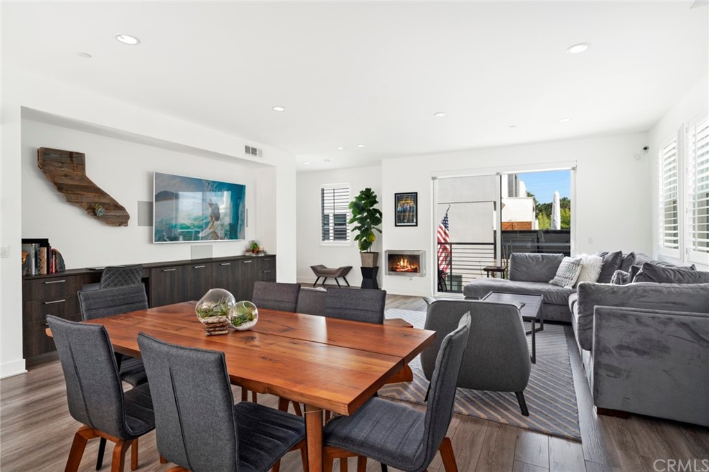1267 Westreef Costa Mesa, CA 92627 - Photo 5 of 34 a view of a dining room with furniture and wooden floor