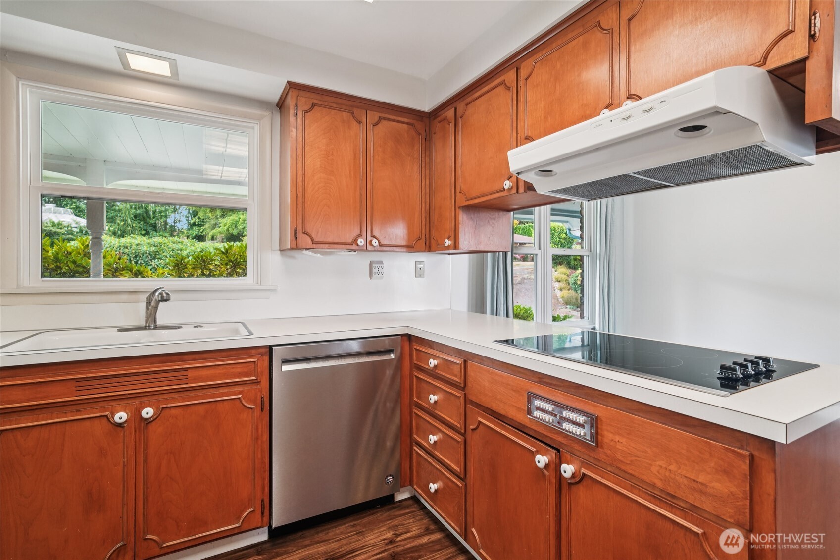 715 35th Street Everett, WA 98201 - Photo 11 of 36 a kitchen with stainless steel appliances granite countertop a sink and a stove