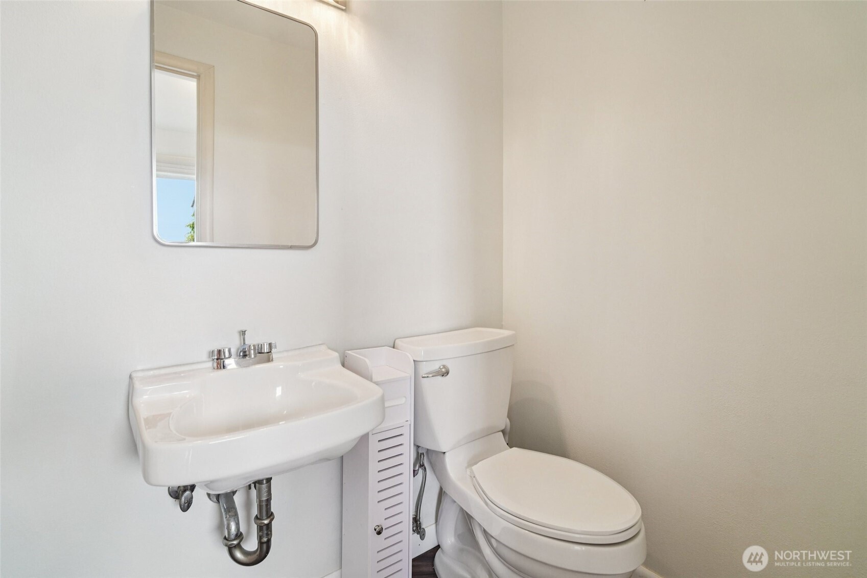 715 35th Street Everett, WA 98201 - Photo 15 of 36 a bathroom with a toilet a sink and mirror