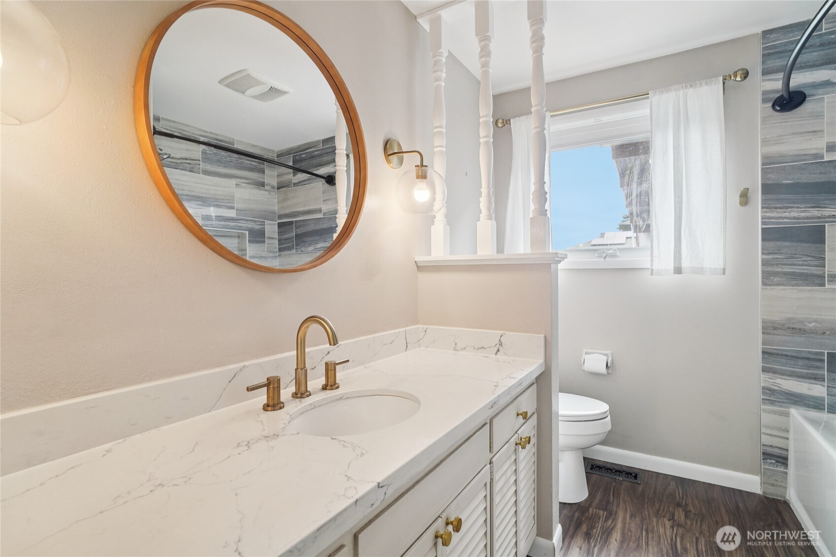 715 35th Street Everett, WA 98201 - Photo 20 of 36 a bathroom with a toilet a sink and a mirror