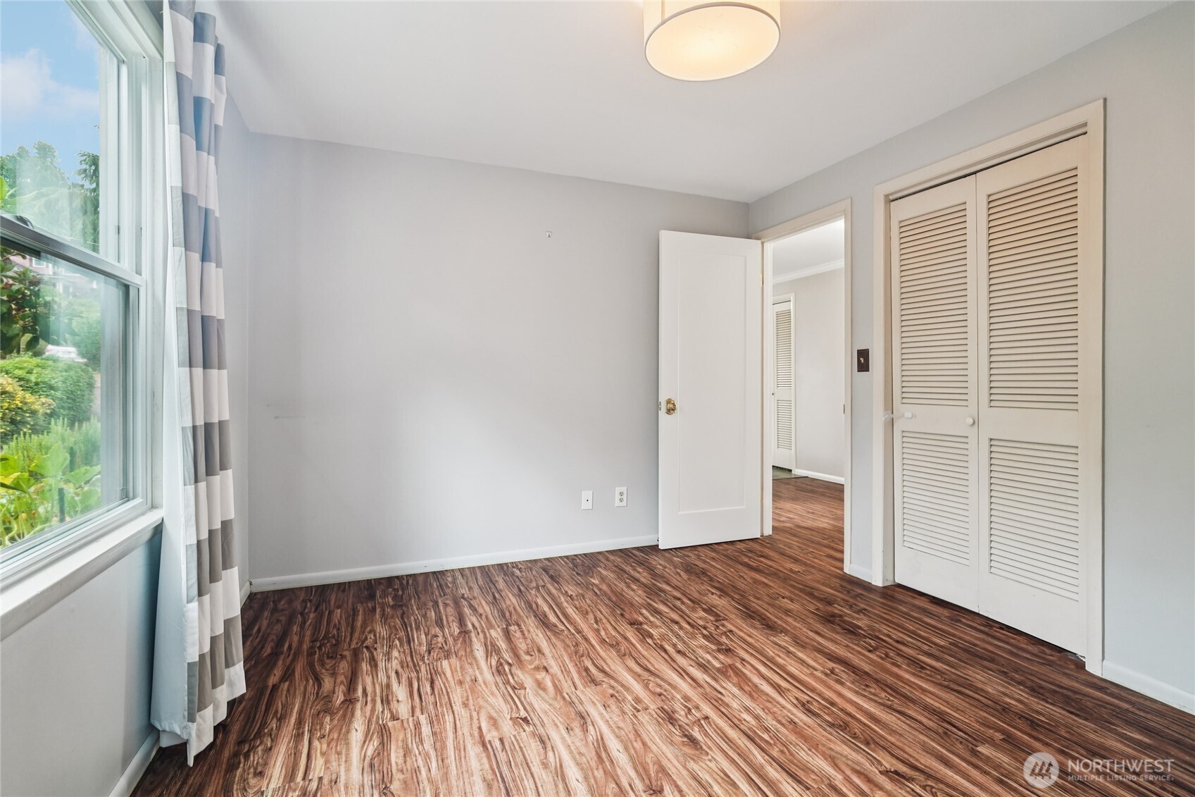 715 35th Street Everett, WA 98201 - Photo 22 of 36 a view of a room with wooden floor and window