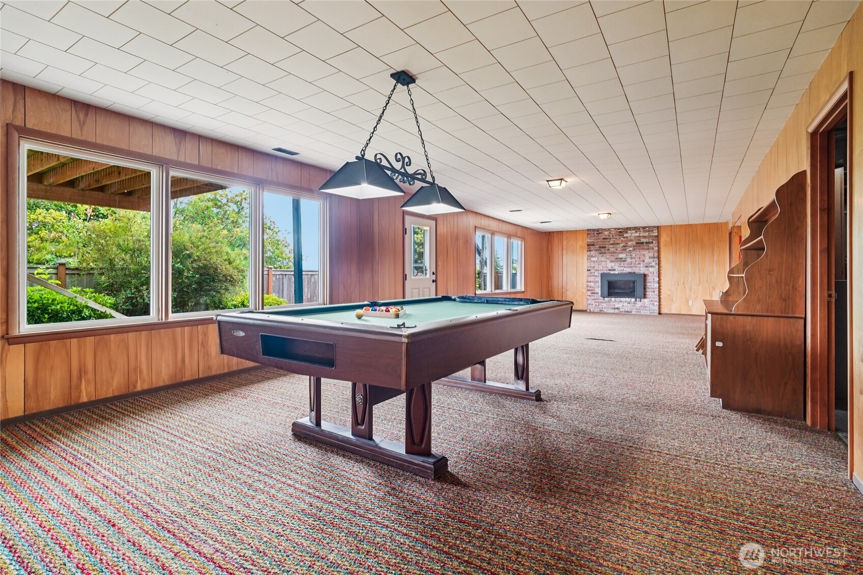 715 35th Street Everett, WA 98201 - Photo 27 of 36 a living room with a table chairs and a wooden floor