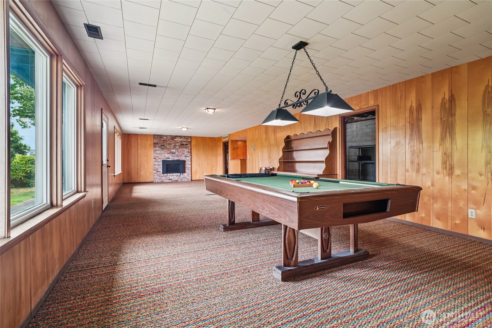 715 35th Street Everett, WA 98201 - Photo 28 of 36 a room with wooden floor pool table and windows