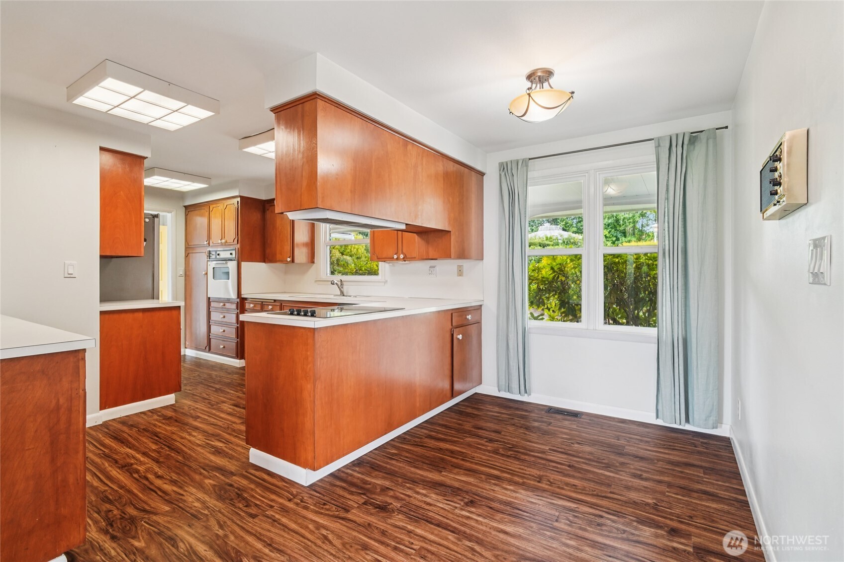 715 35th Street Everett, WA 98201 - Photo 10 of 36 a kitchen with stainless steel appliances granite countertop a stove a sink and a refrigerator