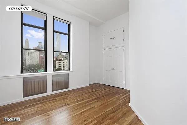80 Varick Street, Unit 6D Manhattan, NY 10013 - Photo 1 of 1 a bedroom with a bed and window