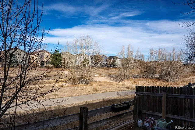 a view of a outdoor space with wooden fence