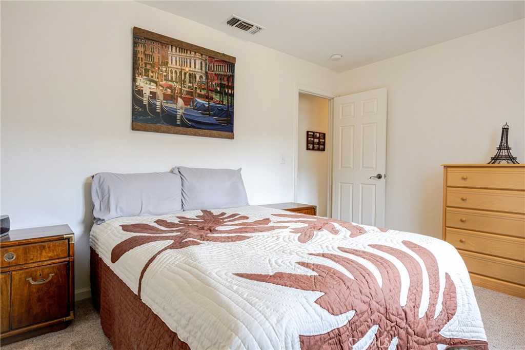30142 Revis Road Coarsegold, CA 93614 - Photo 19 of 43 a bedroom with a bed and painting on the wall