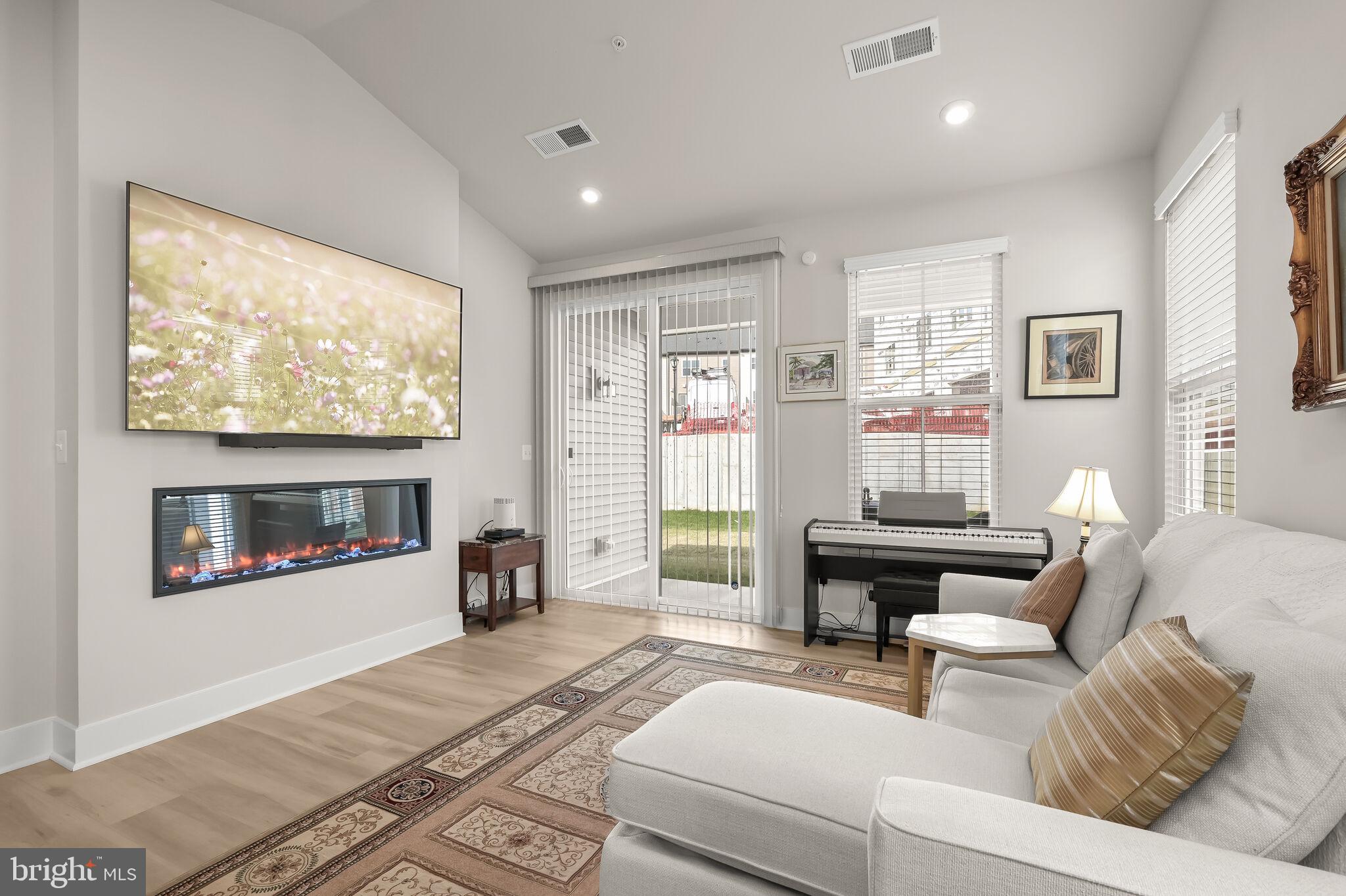 22112 Plover Street Clarksburg, MD 20871 - Photo 16 of 46 Electric fireplace and patio access