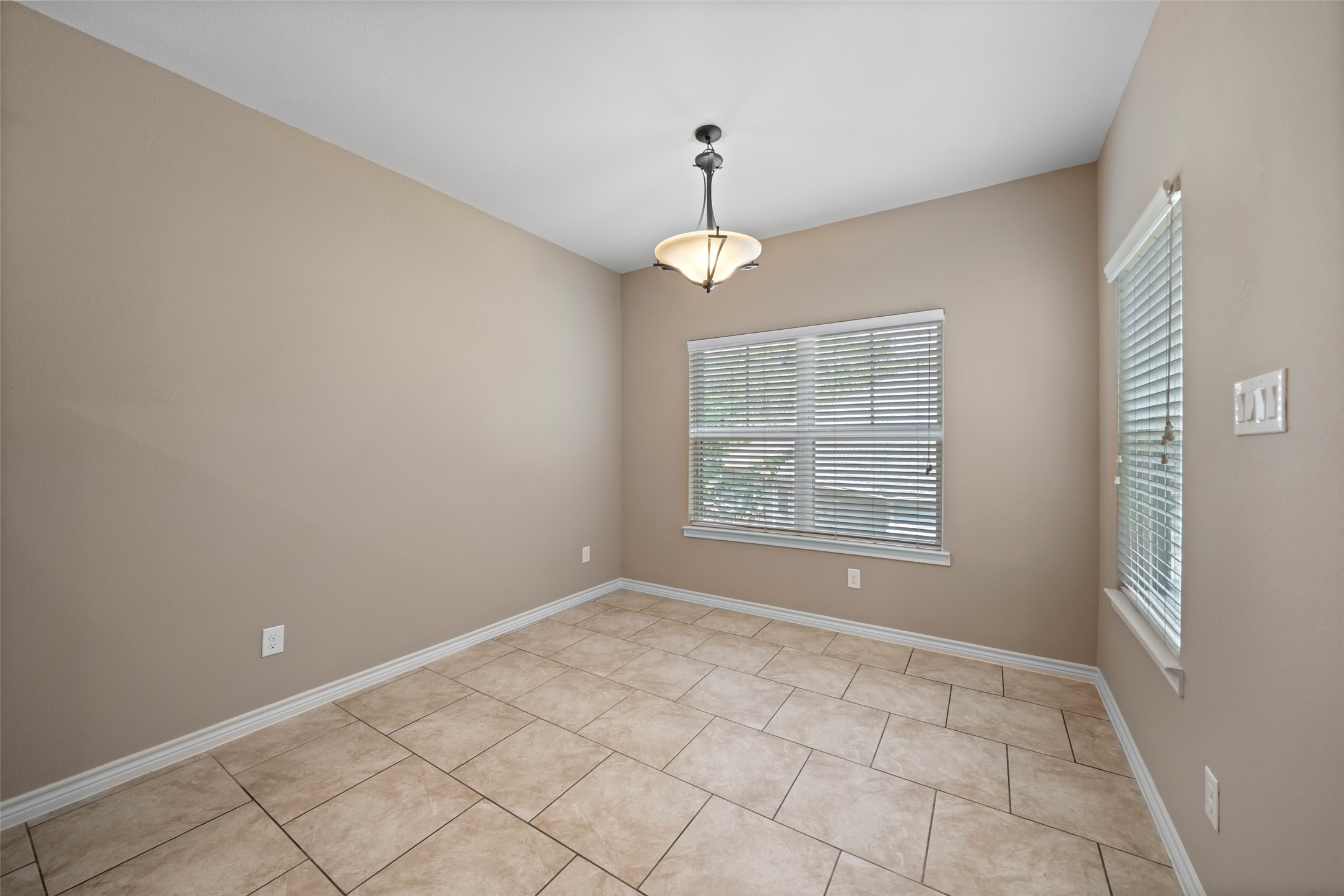 1413 East April Villa, Unit B Conroe, TX 77356 - Photo 14 of 33 a view of an empty room with a window