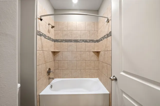 a bathroom with a granite countertop sink double and mirror