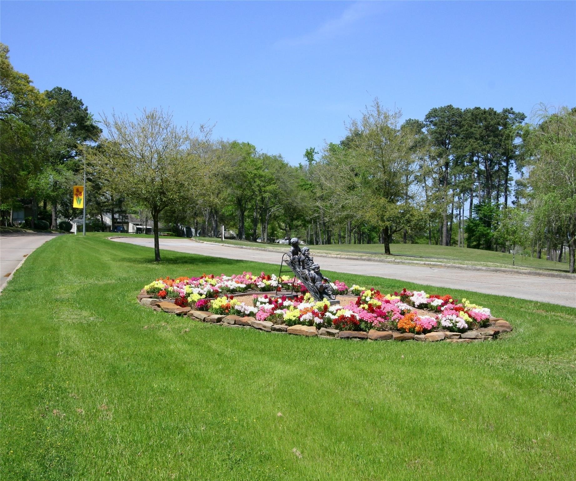 1413 East April Villa, Unit B Conroe, TX 77356 - Photo 27 of 33 a view of an flowers in front of the house