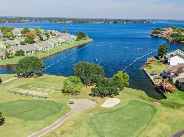 an aerial view of a house with garden space and street view