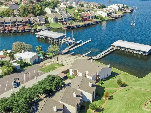 a view of a swimming pool with a yard