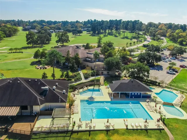 an aerial view of a house with a lake view