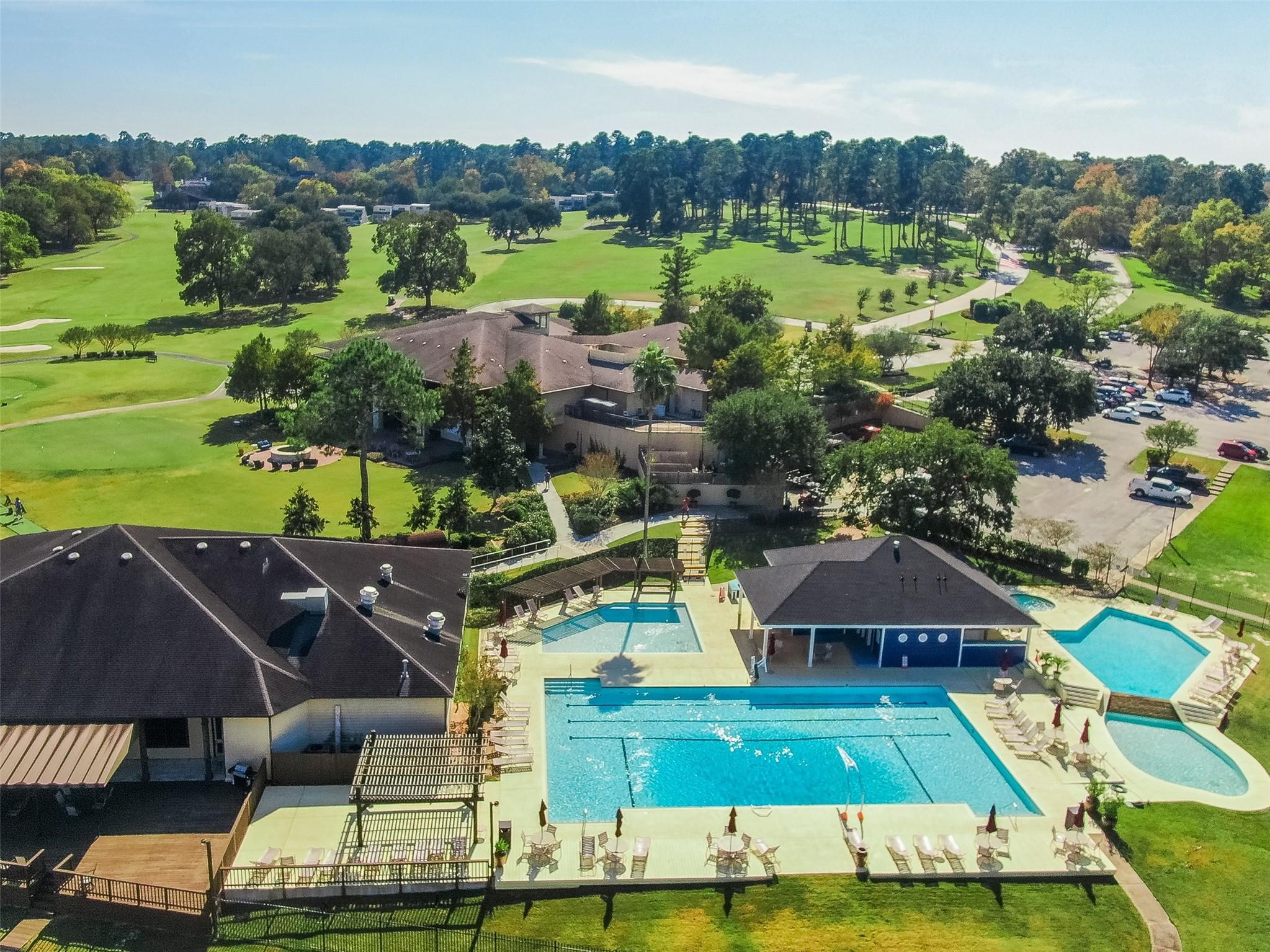 1413 East April Villa, Unit B Conroe, TX 77356 - Photo 32 of 33 an aerial view of a house with a big yard