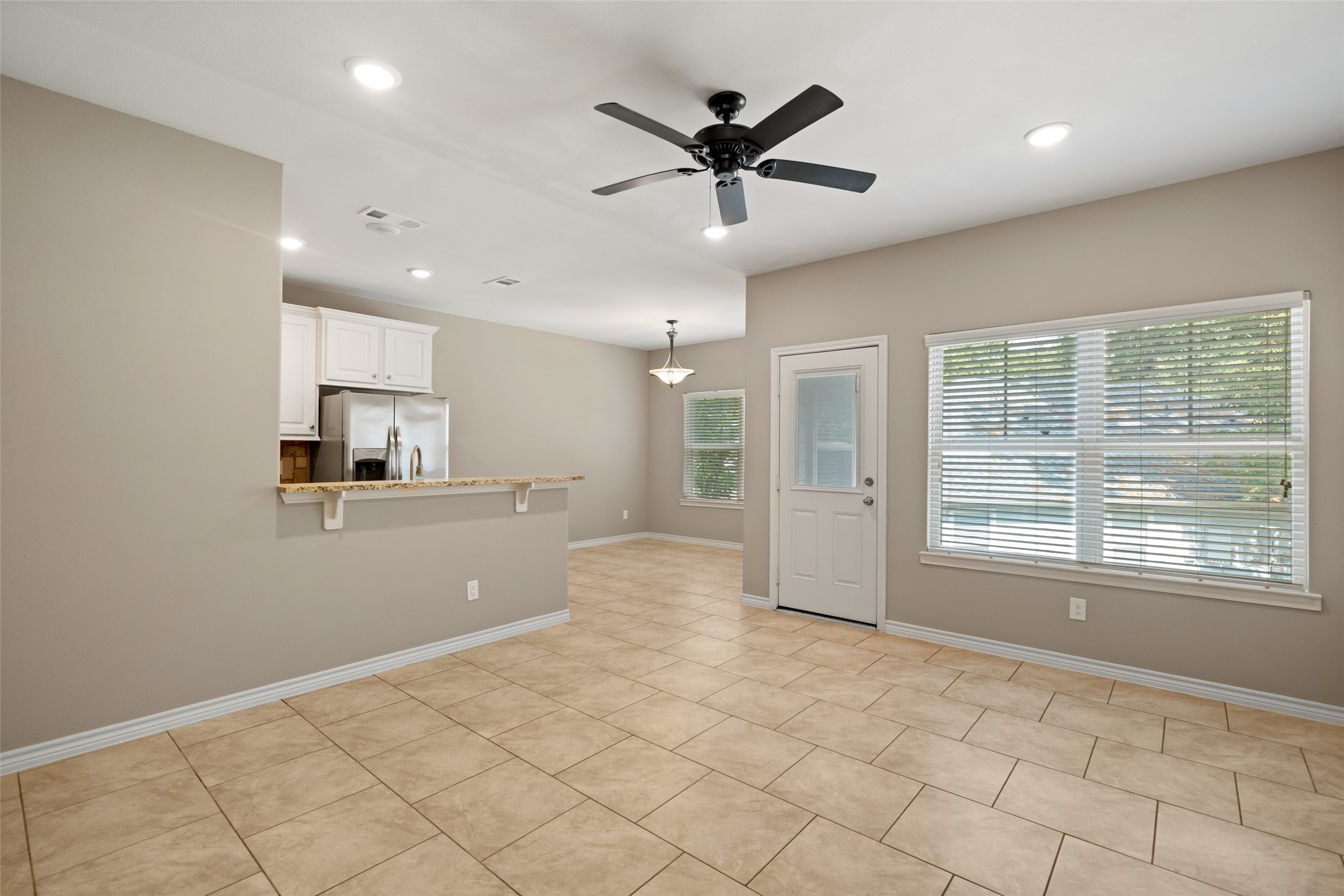 1413 East April Villa, Unit B Conroe, TX 77356 - Photo 6 of 33 a view of a kitchen with a sink and a window