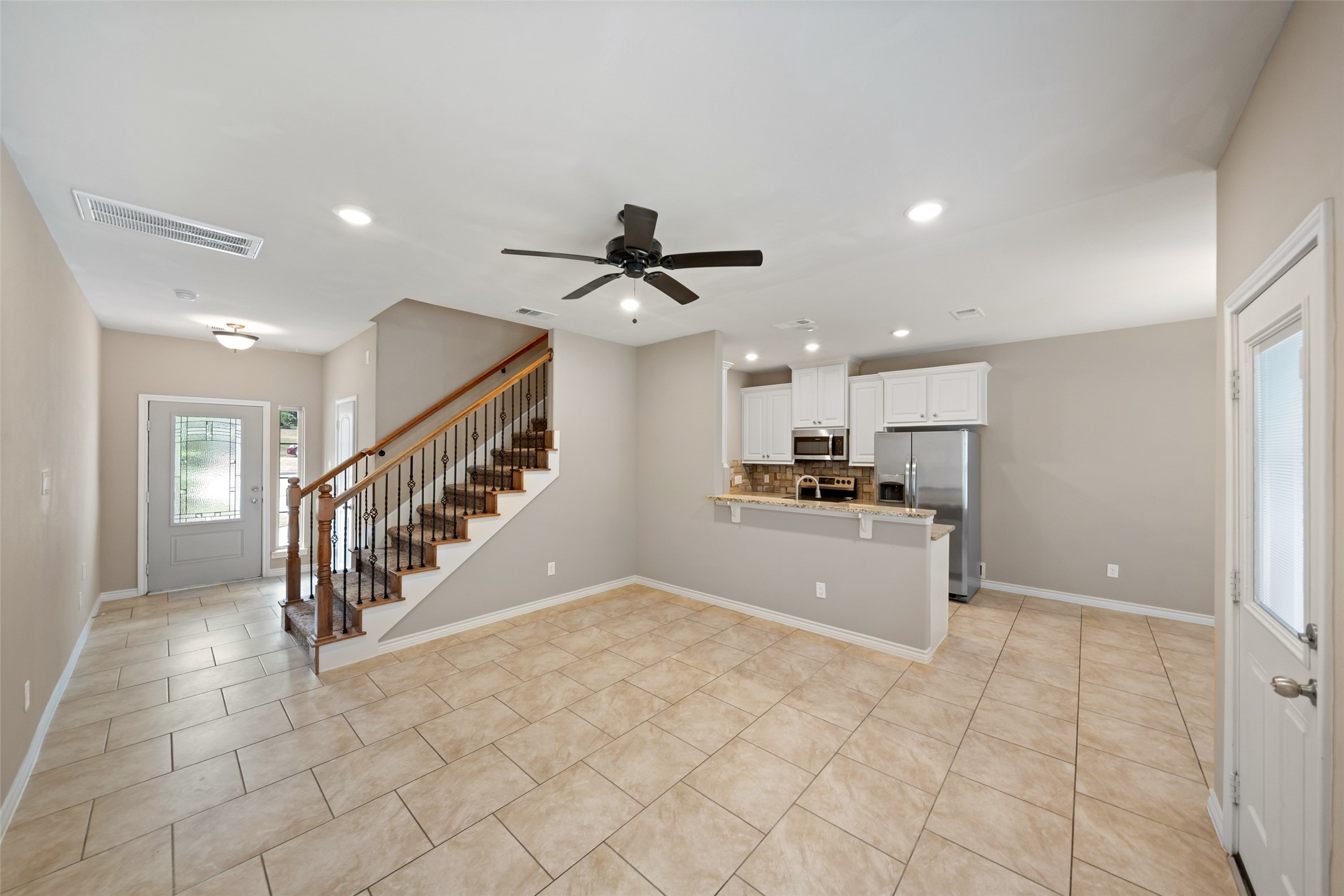 1413 East April Villa, Unit B Conroe, TX 77356 - Photo 7 of 33 a view of a kitchen with a sink and a window