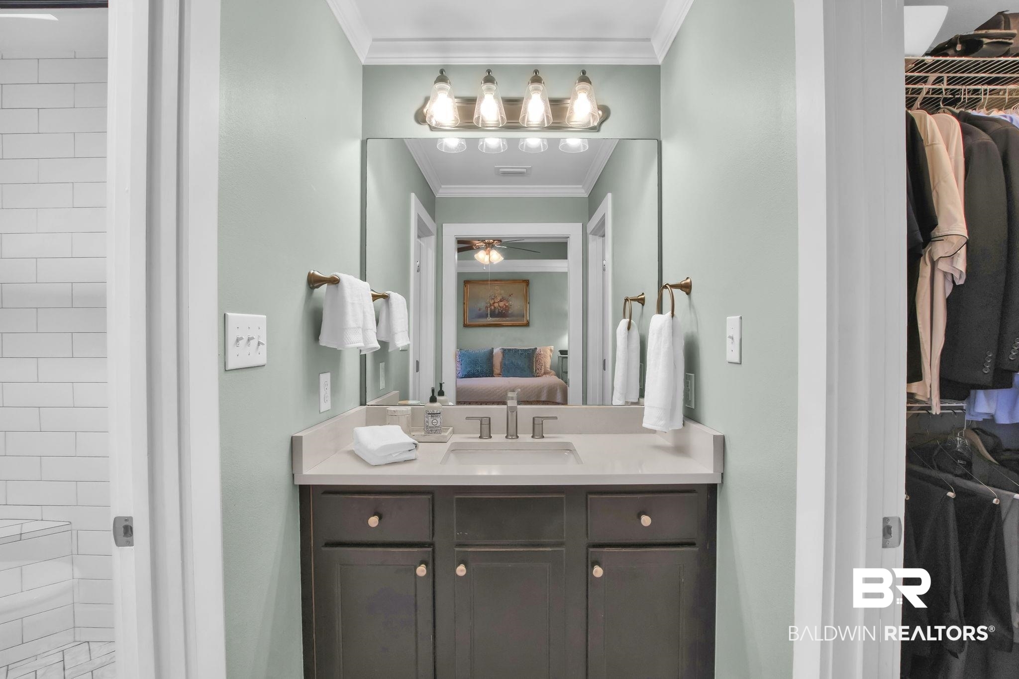 203 Lakefront Circle Summerdale, AL 36580 - Photo 36 of 69 Bathroom featuring ceiling fan, vanity, a tile shower, and ornamental molding
