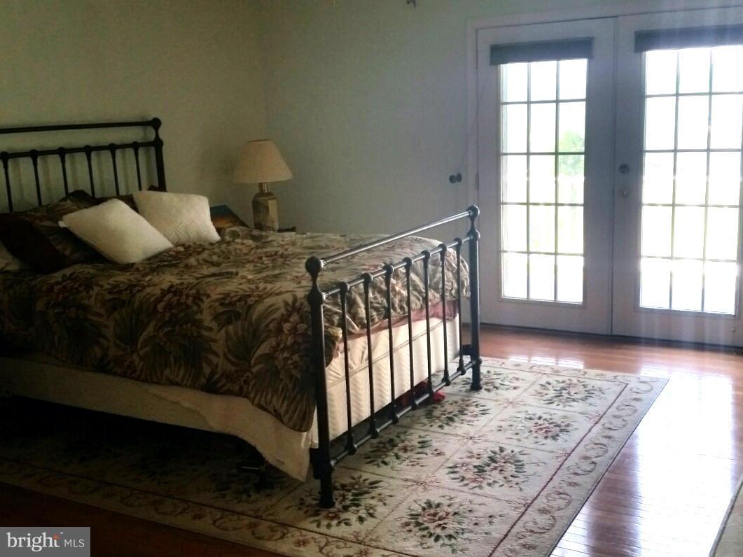 1679 Grandview Road Pasadena, MD 21122 - Photo 23 of 25 one of two Master Suites leads to private balcony