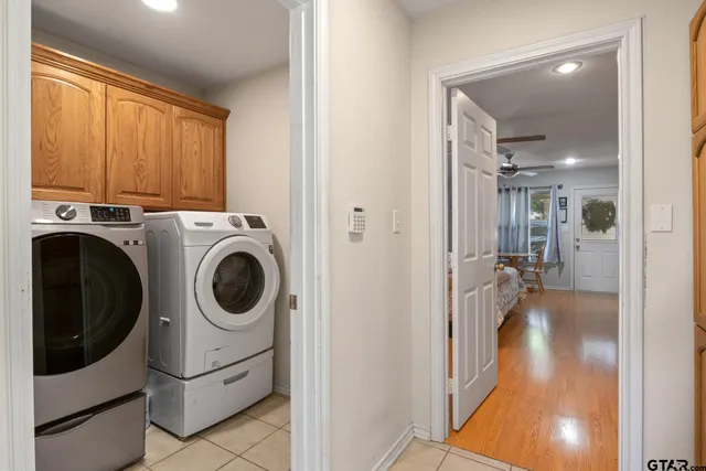 a view of a hallway with washer and dryer