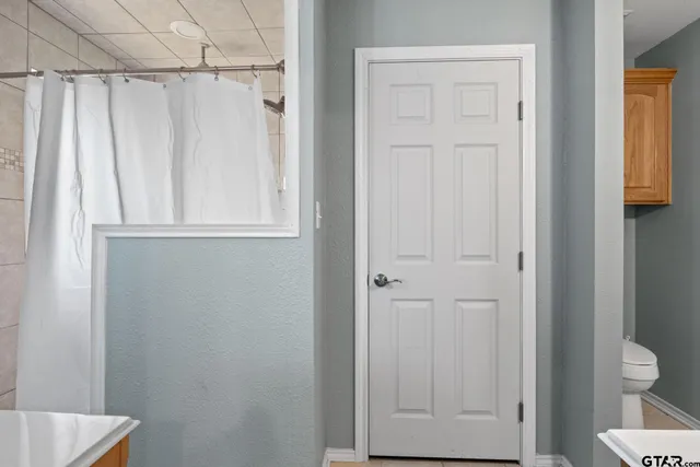 a view of a bathroom with a shower and a sink