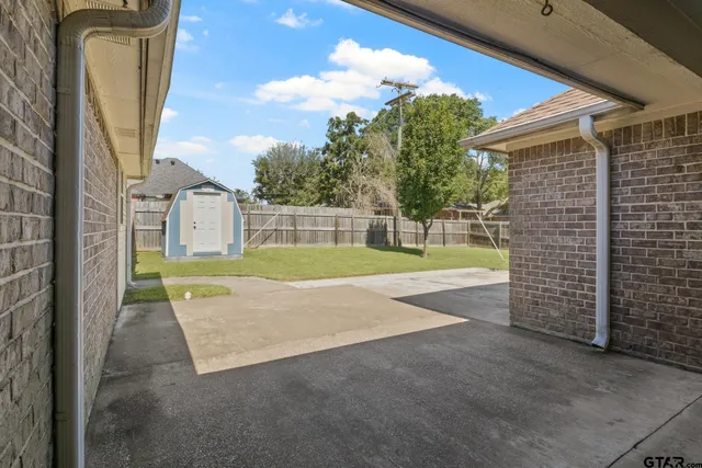 a view of swimming pool with a yard