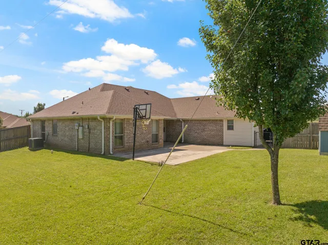 a view of a large pool with a yard