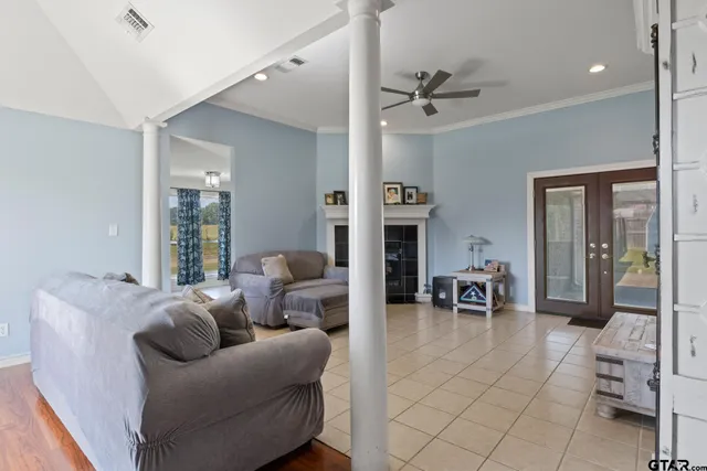 a living room with furniture and a large window