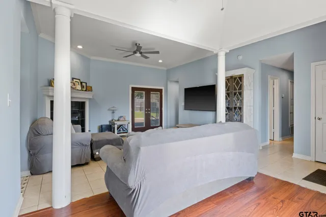 a spacious bedroom with a bed and a couch