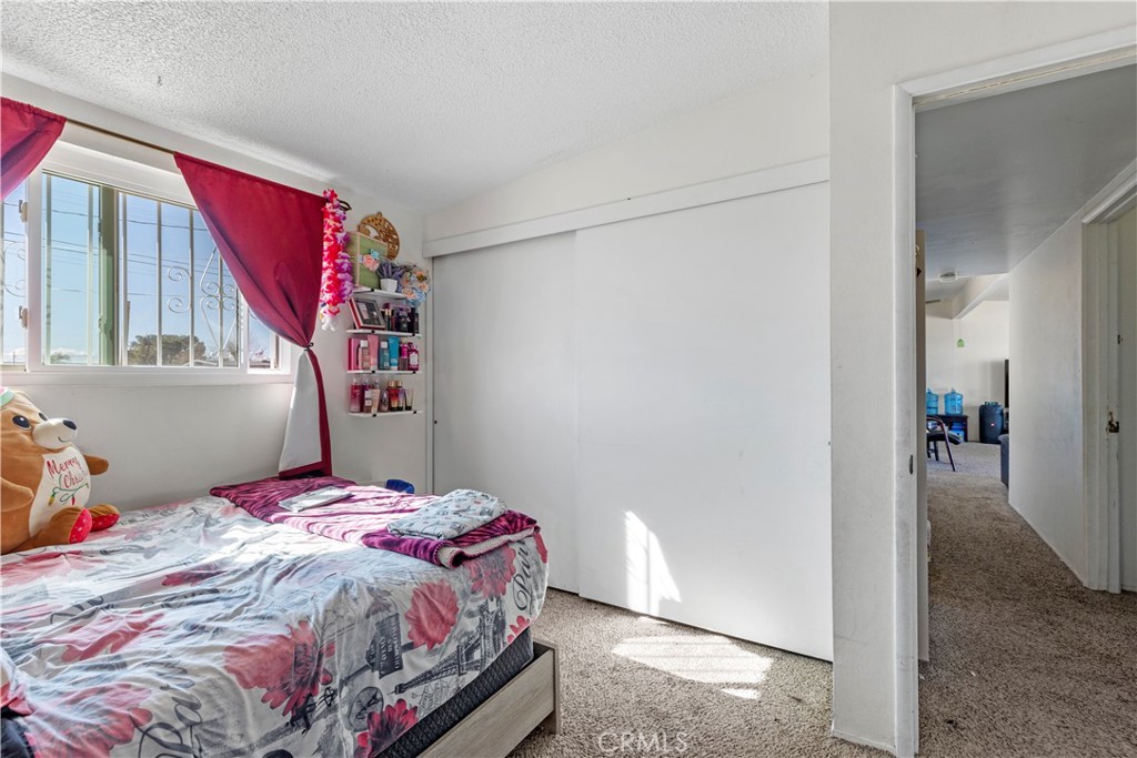 13325 Margo Street North Edwards, CA 93523 - Photo 12 of 17 a bedroom with a bed and a window