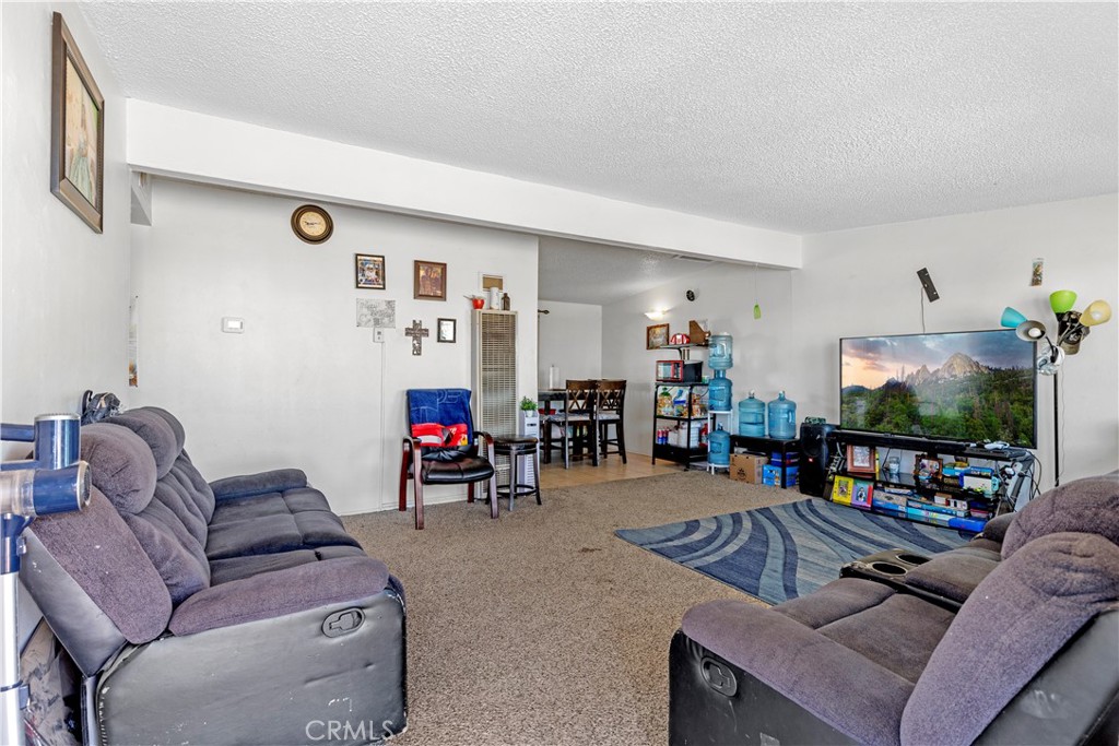 13325 Margo Street North Edwards, CA 93523 - Photo 4 of 17 a living room with furniture and a flat screen tv