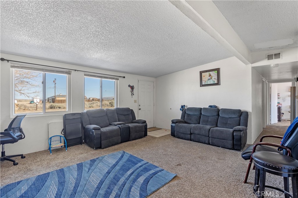 13325 Margo Street North Edwards, CA 93523 - Photo 5 of 17 a living room with furniture and a window