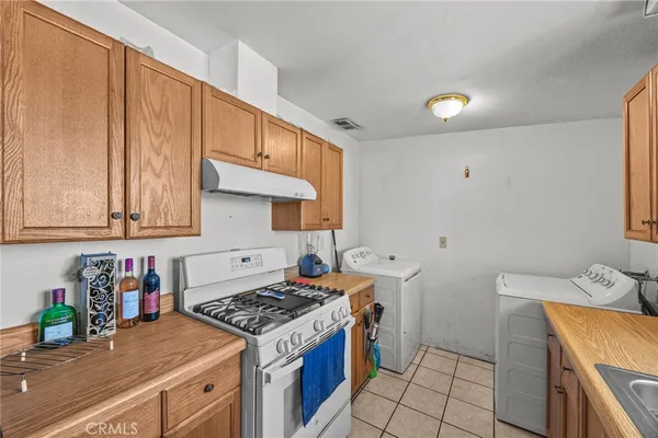 a kitchen with a stove and a sink