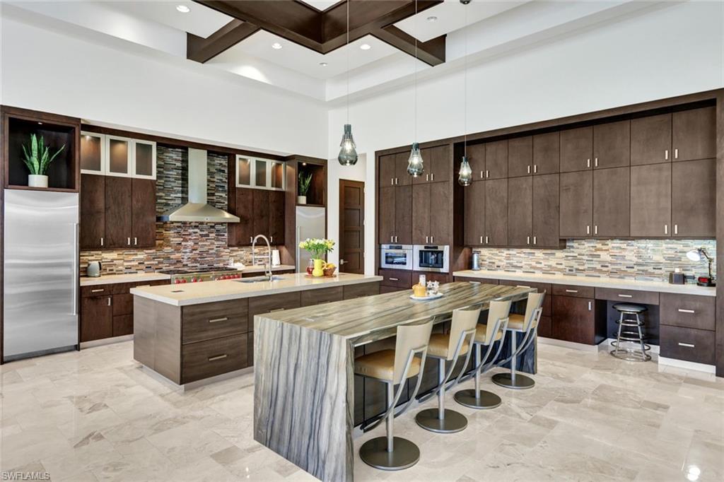 4431 Wayside Drive Naples, FL 34119 - Photo 12 of 49 a kitchen with stainless steel appliances granite countertop a stove and a sink
