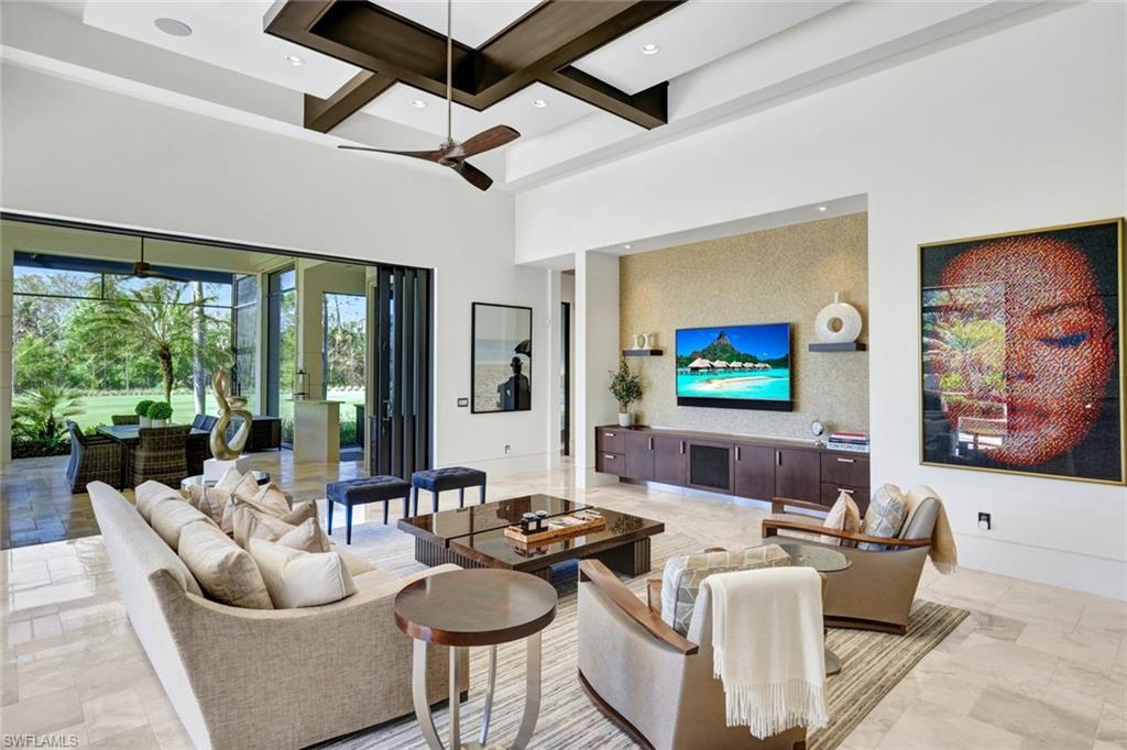 4431 Wayside Drive Naples, FL 34119 - Photo 18 of 49 a living room with couches and a flat screen tv