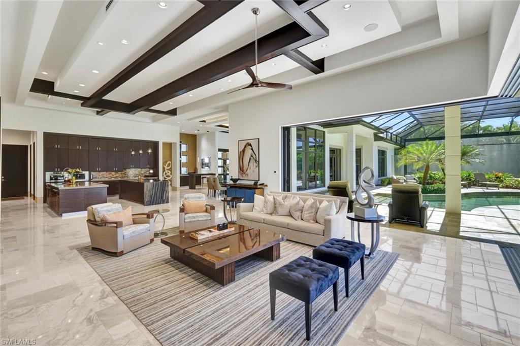 4431 Wayside Drive Naples, FL 34119 - Photo 20 of 49 a living room with furniture and a large window