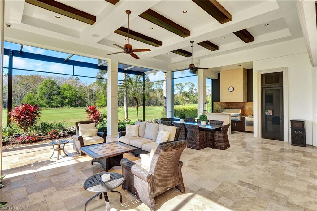 4431 Wayside Drive Naples, FL 34119 - Photo 22 of 49 a living room with furniture and a large window