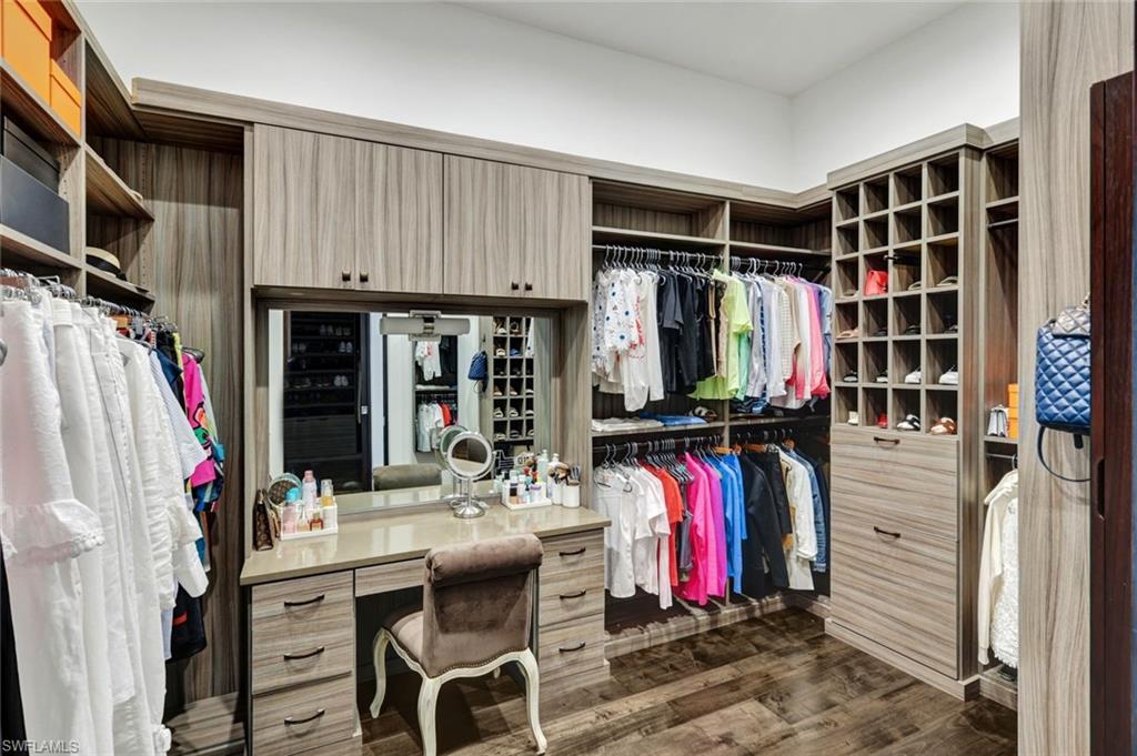 4431 Wayside Drive Naples, FL 34119 - Photo 34 of 49 a view of walk in closet with clothes