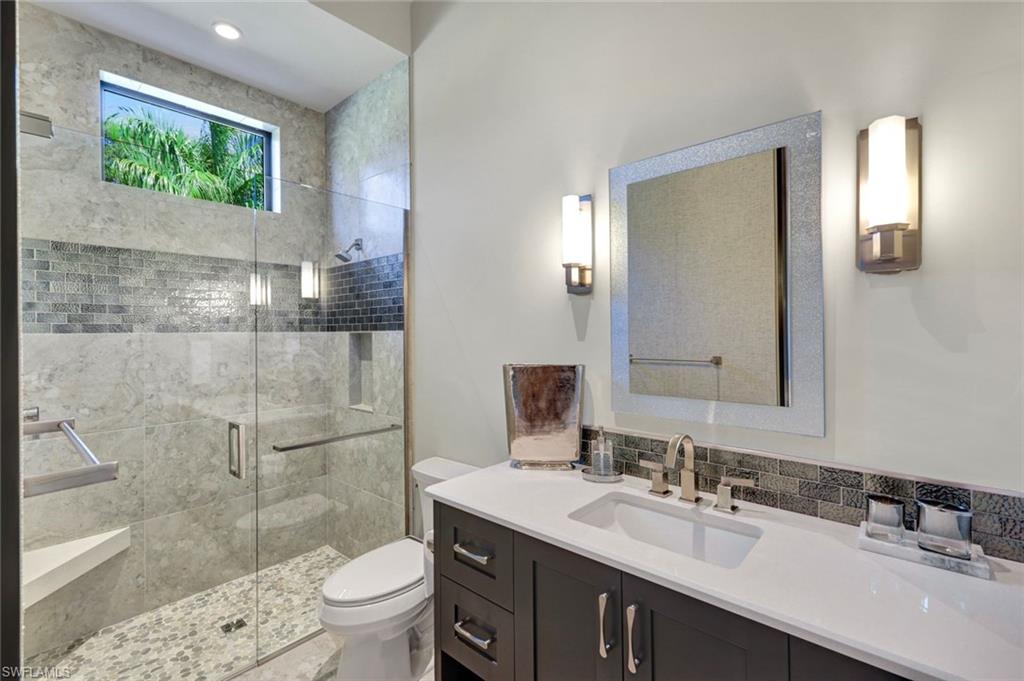 4431 Wayside Drive Naples, FL 34119 - Photo 36 of 49 a bathroom with a sink a toilet and shower